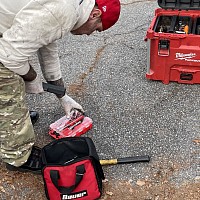 mobile mechanic replacing brakes at home driveway